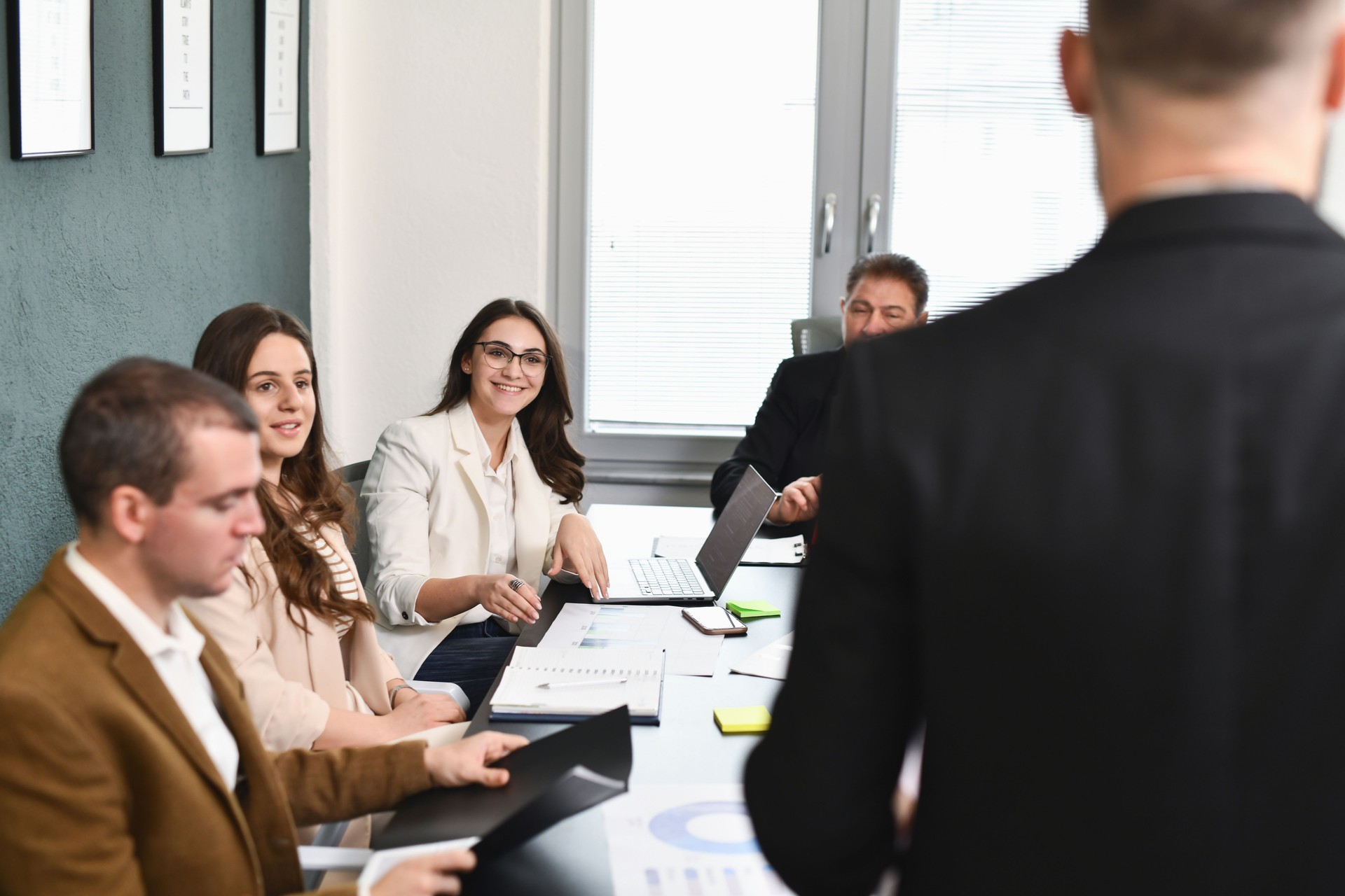 Female Employees Smiling When Hearing Their Suggestion Will be Accepted on Business Meeting